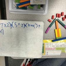 White board with math equation and blocks