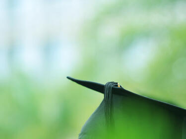 Detail view of graduation caps during commencement.