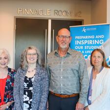 Group photo of 4 female retirees, one male retiree