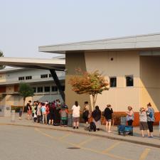 Line up of families outside of the school