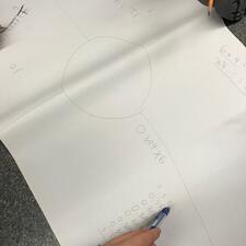 Learning Math, paper and student hand.